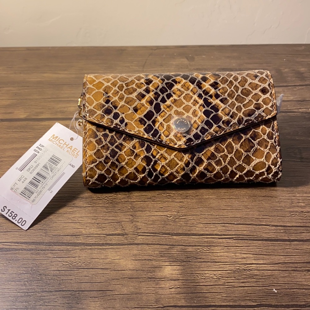 Mew with tags snake like print purse.